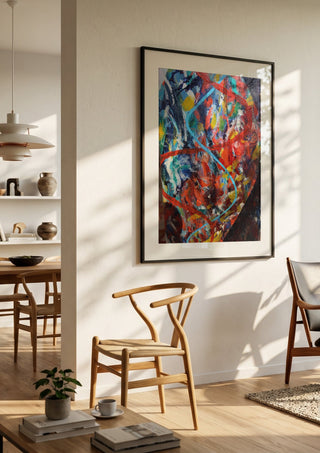 Spiral, the code of life. by António D'Albuquerque in a black frame in a bright dining room with wooden chairs