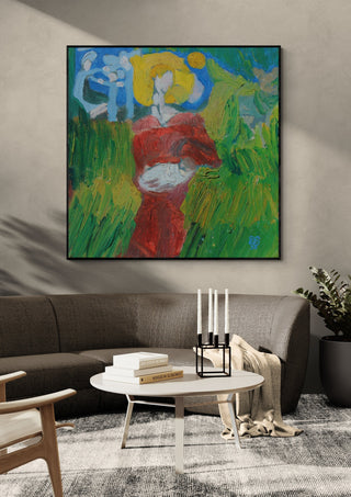 The Woman in the Wheat by António D'Albuquerque in a black frame above a grey sofa with candlesticks on a round table