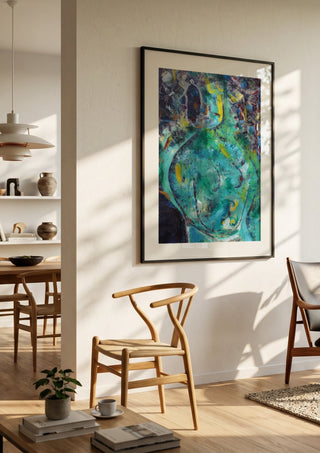 Belly of the Sea by António D'Albuquerque in a black frame in a bright dining room with wooden chairs
