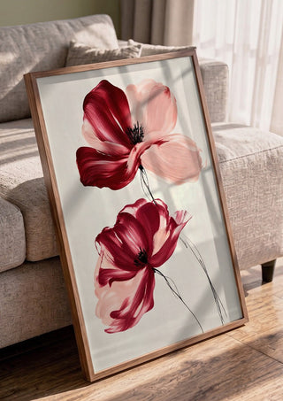 Crimson and Blush by Martina Karlsson in a walnut frame leaning against a grey sofa