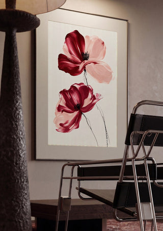 Crimson and Blush by Martina Karlsson framed in a dim room beside a tubular steel chair