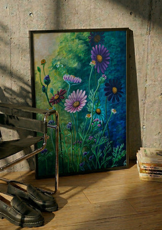 Daisies at Dusk by Svetla Stoyanova Bassi in a black frame leaning against a concrete wall by a steel chair