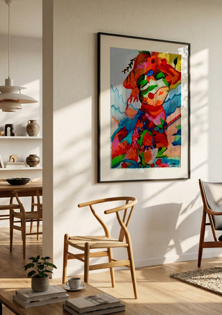 The little frog by Nittaart in a black frame in a bright dining room with wooden chairs