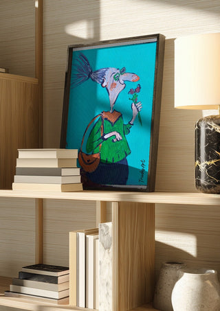 Mit spitzer Nase und weichem Kern by Trude in a dark frame on a wooden shelf beside books and a lamp