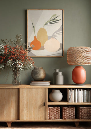 Vases 2 by ThingDesign above a wooden sideboard on a sage green wall