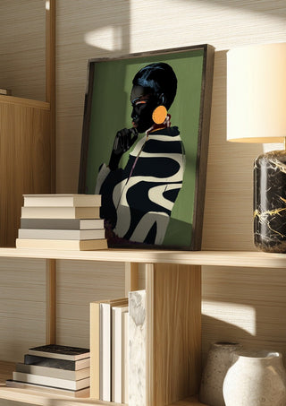 Form and Presence by ThingDesign in a dark frame on a wooden shelf beside books and a lamp