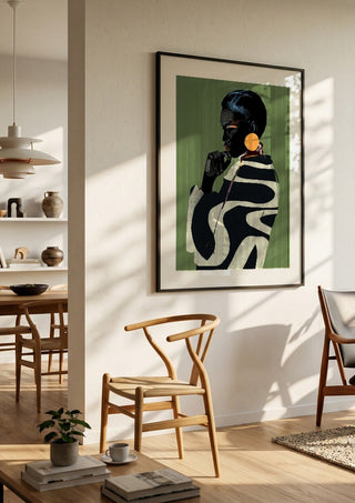 Form and Presence by ThingDesign in a black frame in a bright dining room with wooden chairs