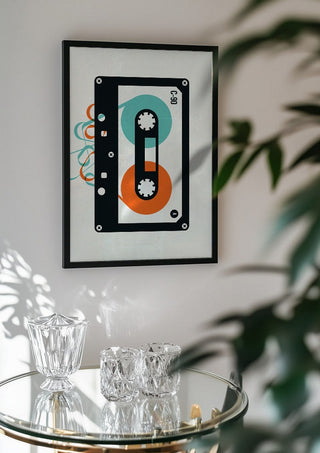 Mixtape by Bo Lundberg in a black frame above a glass table with crystal glassware