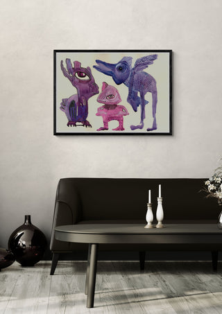 Strange little creatures by Lena Galé in a black frame above a dark sofa with candlesticks on a round table
