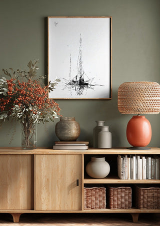 Two Masts by Justyna Kopania above a wooden sideboard on a sage green wall