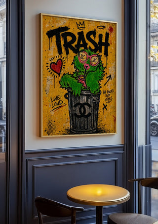 Trash x Grafitti by Decker Studios in an oak frame on a panelled cafe wall