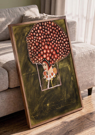 Madame Rose by Ali Kasap in a walnut frame leaning against a grey sofa