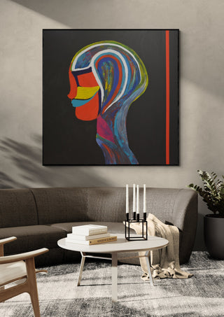 RED LINE by Ali Kasap in a black frame above a dark sofa with candlesticks on a round table