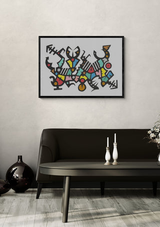 Carnival Glyphs by John Larkin in a black frame above a dark sofa with candlesticks on a round table