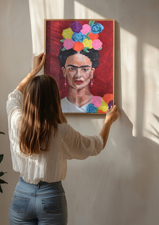 Frida Kahlo by creatievananne being hung on a sunlit wall