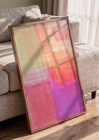 soft atmospheric composition by Iris Lehnhardt in a walnut frame leaning against a grey sofa
