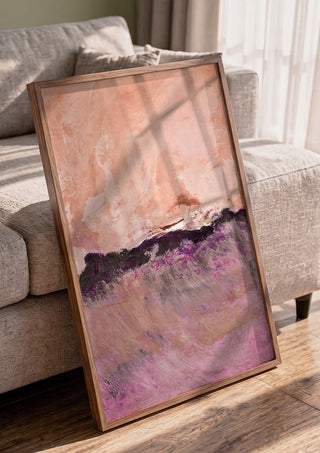 expressive landscape by Iris Lehnhardt in a walnut frame leaning against a grey sofa