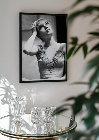 The Russian ballet dancer by Bettinafloorphoto in a black frame above a glass table with crystal glassware