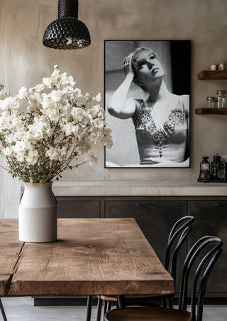 The Russian ballet dancer by Bettinafloorphoto in a black frame above a rustic table with white flowers