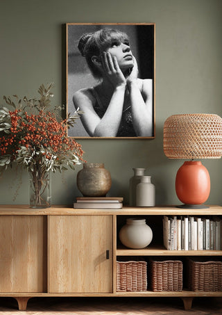 The Russian ballet dancer by Bettinafloorphoto above a wooden sideboard on a sage green wall