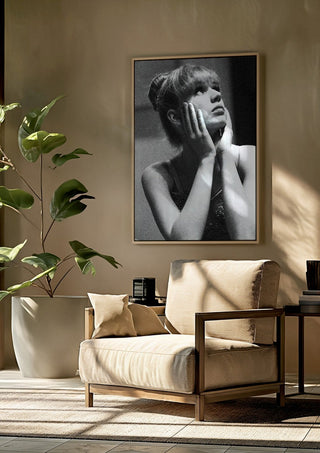 The Russian ballet dancer by Bettinafloorphoto framed above a beige armchair beside a potted plant