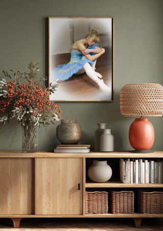 The Russian ballet dancer by Bettinafloorphoto above a wooden sideboard on a sage green wall