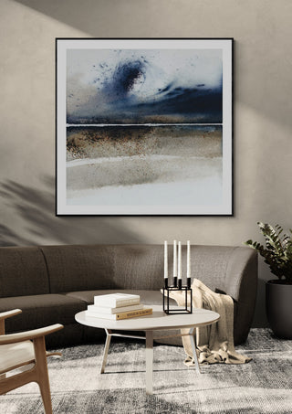 A wave from the past by Tania Zubareva in a black frame above a grey sofa with a round coffee table
