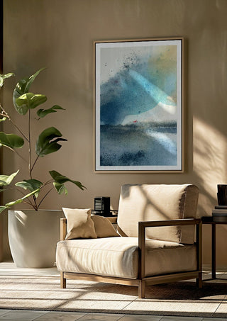 Blue October by Tania Zubareva framed above a beige armchair beside a potted plant