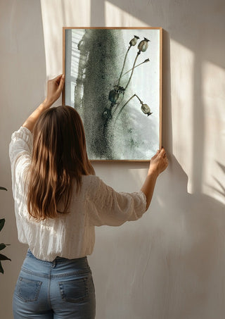 Death by Tania Zubareva being hung on a sunlit wall
