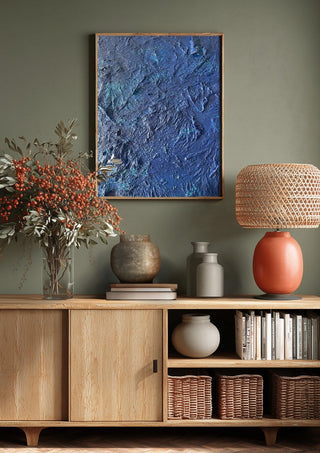 Das Meer by Sophie Schillen above a wooden sideboard on a sage green wall