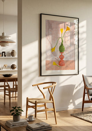 Crocus on pedestal by Creationsbyeditabrus in a black frame in a bright dining room with wooden chairs
