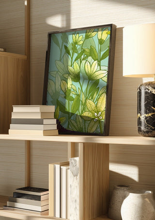 Buttercups in spring by Creationsbyeditabrus in a dark frame on a wooden shelf beside books and a lamp