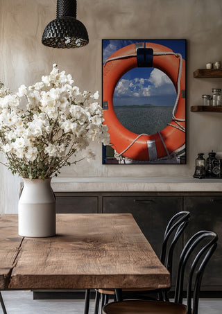 Three Layers of Presence by Bora Kőhalmi in a black frame above a rustic table with white flowers