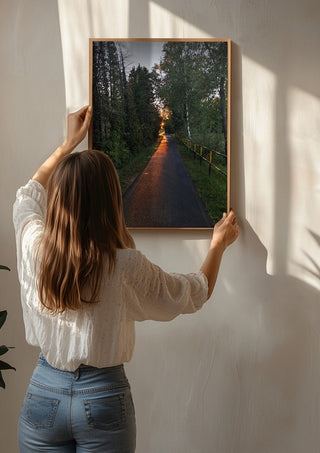 The Amber Forest Path by Bora Kőhalmi being hung on a sunlit wall