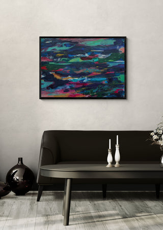 Ripples by Janet Bell in a black frame on a pale wall above a dark sofa with candlesticks