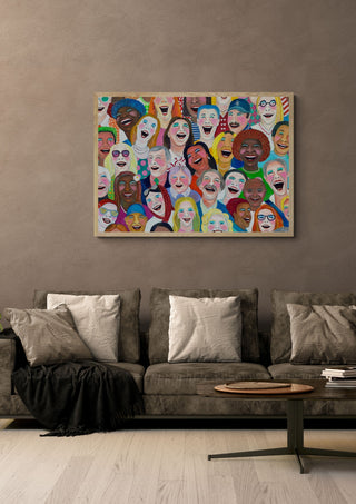 Can´t stop laughing by María Burgaz in a light oak frame on a warm grey wall above a brown sofa