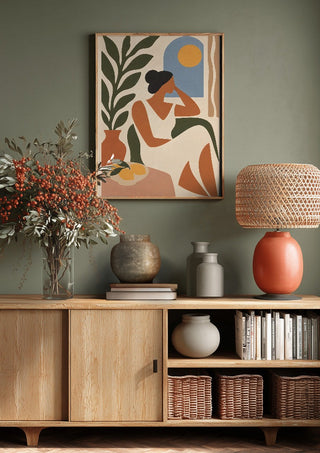 Contemplative Afternoon by TimlessArtworks above a wooden sideboard on a sage green wall