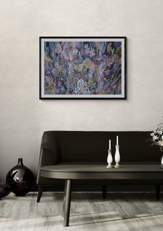 Euforia by Art Anne Lee in a black frame on a pale wall above a dark sofa with candlesticks