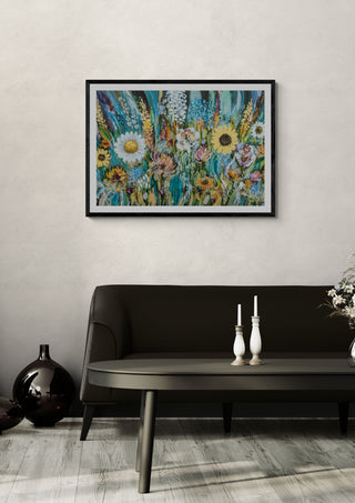 Blomster by Art Anne Lee in a black frame on a pale wall above a dark sofa with candlesticks