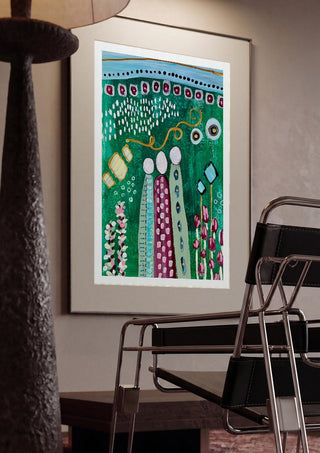 Fairy Tale 2 by Art Anne Lee framed in a dim room beside a tubular steel chair
