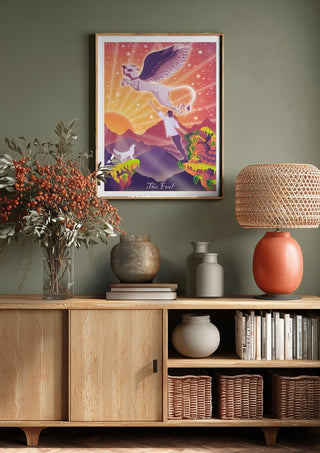 The Fool by Sciurus tarotus above a wooden sideboard on a sage green wall
