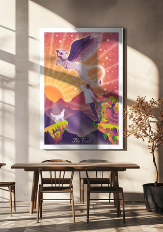 The Fool by Sciurus tarotus hanging above a wooden dining table in warm sunlight