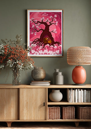 The Strength by Sciurus tarotus above a wooden sideboard on a sage green wall