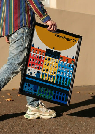 Copenhagen 71 by Bo Lundberg carried in a black frame along a sunny street