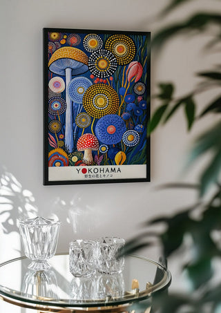 Dotted Garden at Night by Yokohama in a black frame above a glass table with crystal glassware