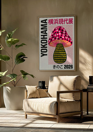 Pink Dot Mushroom Poster by Yokohama framed above a beige armchair beside a potted plant