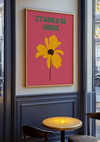 It Could Be Worse by Jakob Falkenberg in an oak frame on a panelled café wall