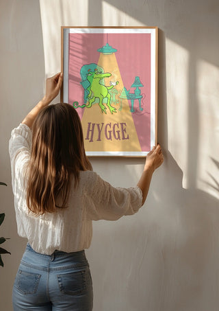 Hygge Crocodile by Elisa Albanelli being hung on a sunlit wall