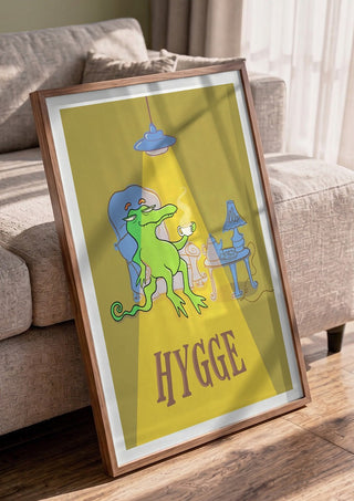 Hygge Crocodile - Yellow by Elisa Albanelli in a walnut frame leaning against a grey sofa
