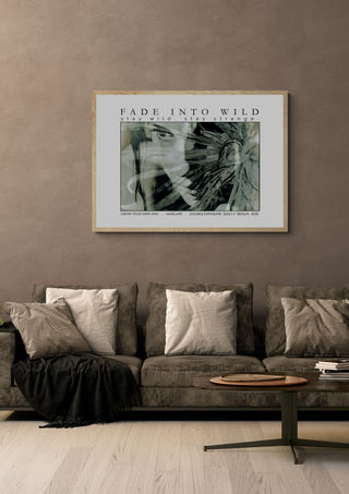 fade into wild by hazelart in a light oak frame on a warm grey wall above a brown sofa